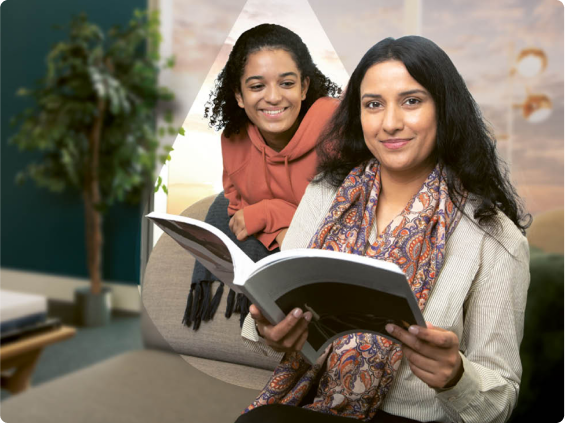A father and his baby lying on the floor.