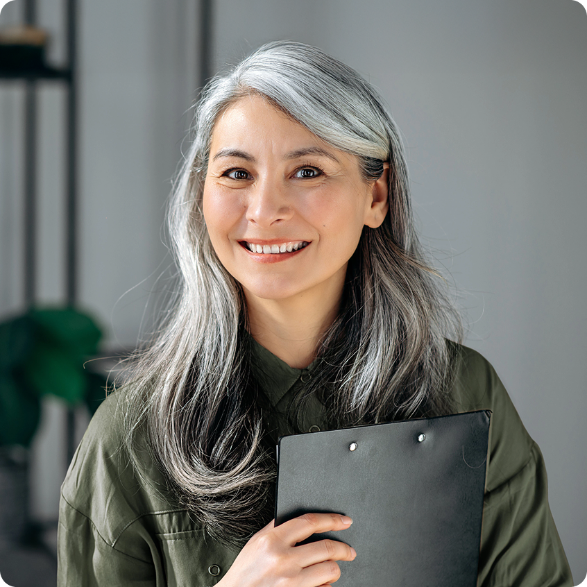 Smiling elderly woman in a green shirt