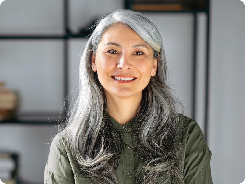 Smiling elderly woman in a green shirt
