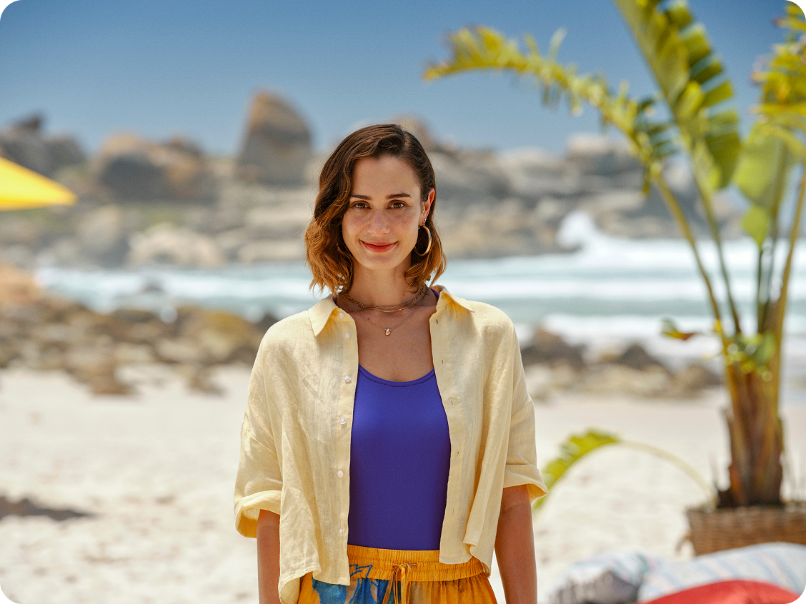 smiling woman in yellow shirt