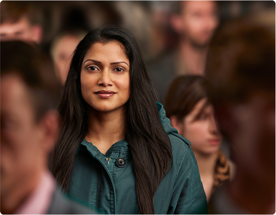A smiling woman with long black hair